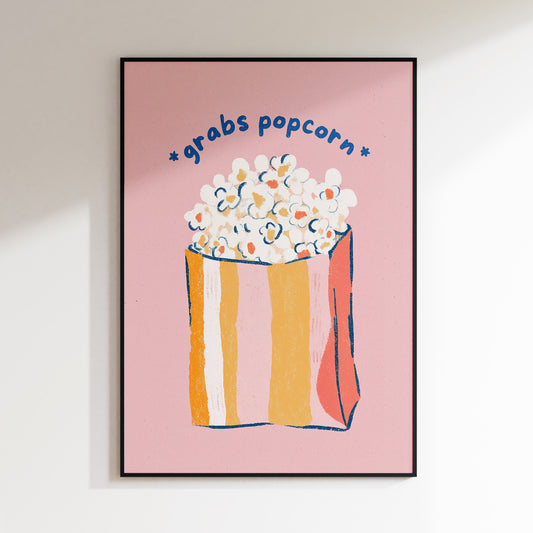 Grabs Popcorn