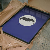 Bat Under Full Moon