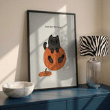 Black Cat Playfully Sitting In A Pumpkin